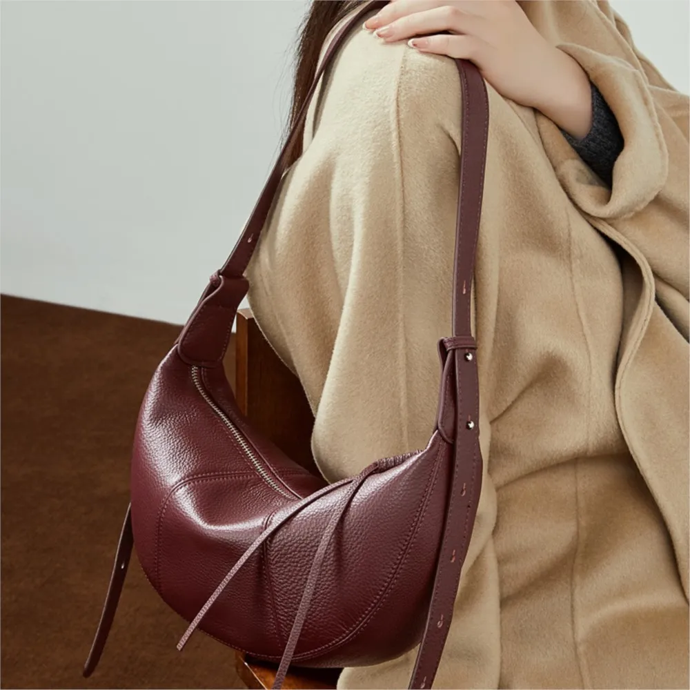 Head layer cow diagonal cross dumpling bag 2026 new genuine leather niche single shoulder practical commuting soft leather women